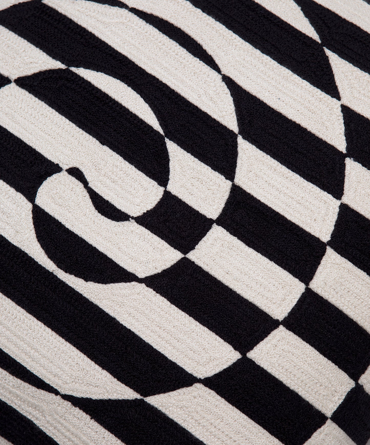 Close up of black and white striped swirl on the Dazzle Pillow Cover.