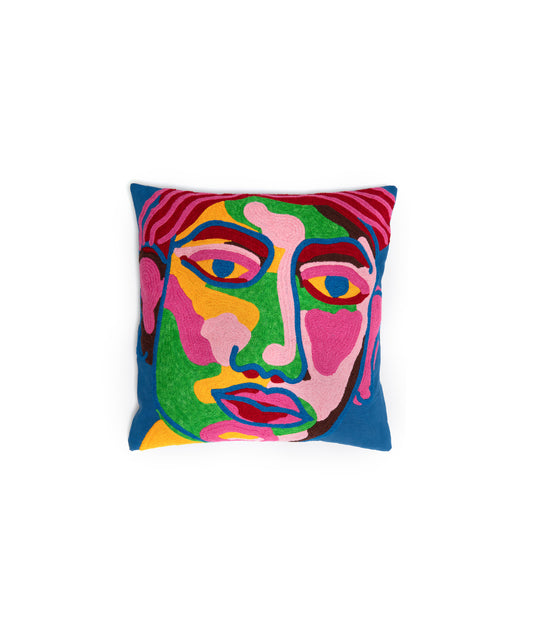 Image of the Portrait Pillow Cover with an abstract portrait made of blue, green, pink, red, and yellow. This pillow cover is 100% cotton and measures 18 inches square.
