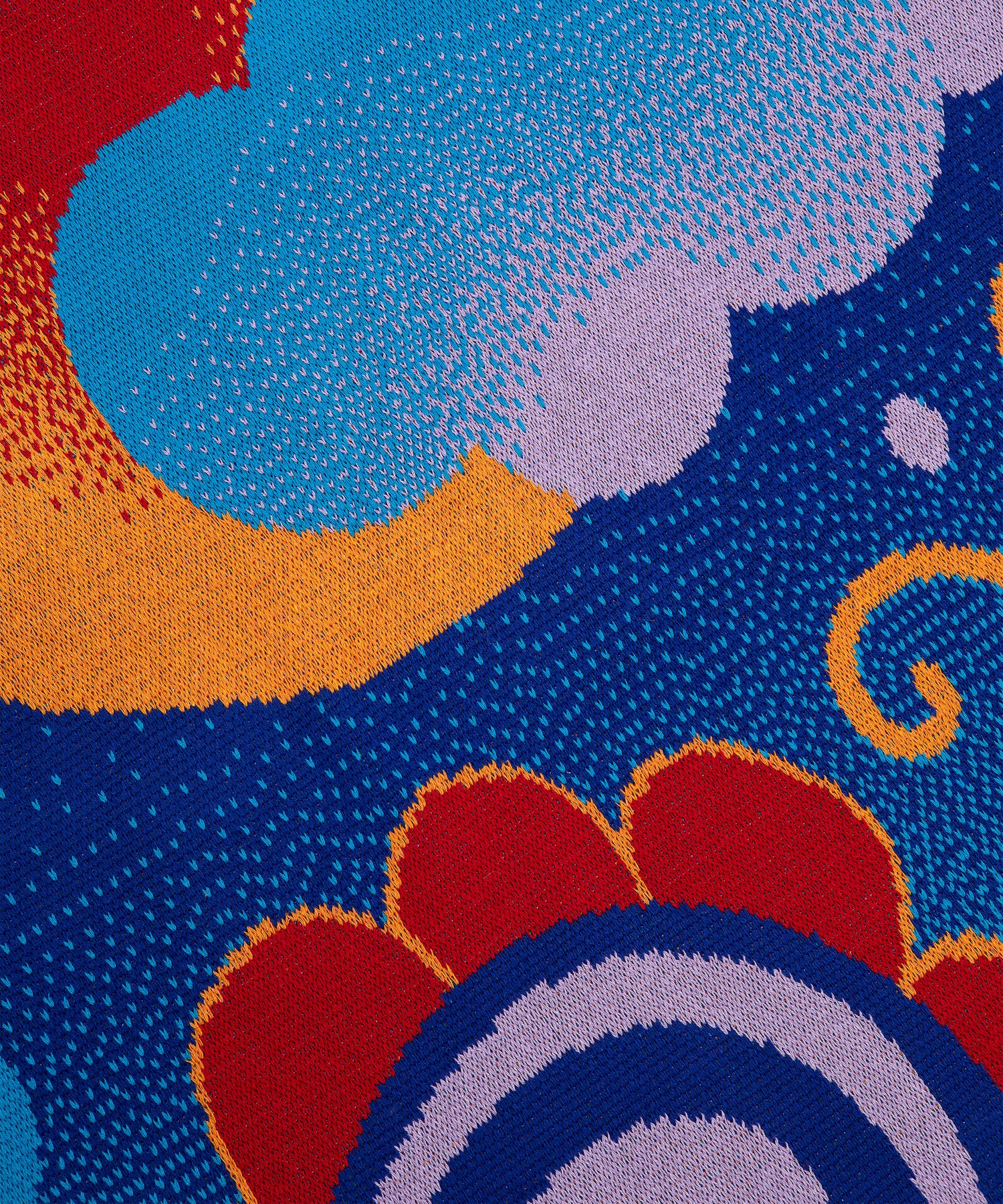 Close up of the Best Buds Blanket showing a flower with red petals outlined in yellow with a spiral light purple and dark blue flower center. Above the cut off flower is a blue cloud that is sitting on top of the red and yellow sun.