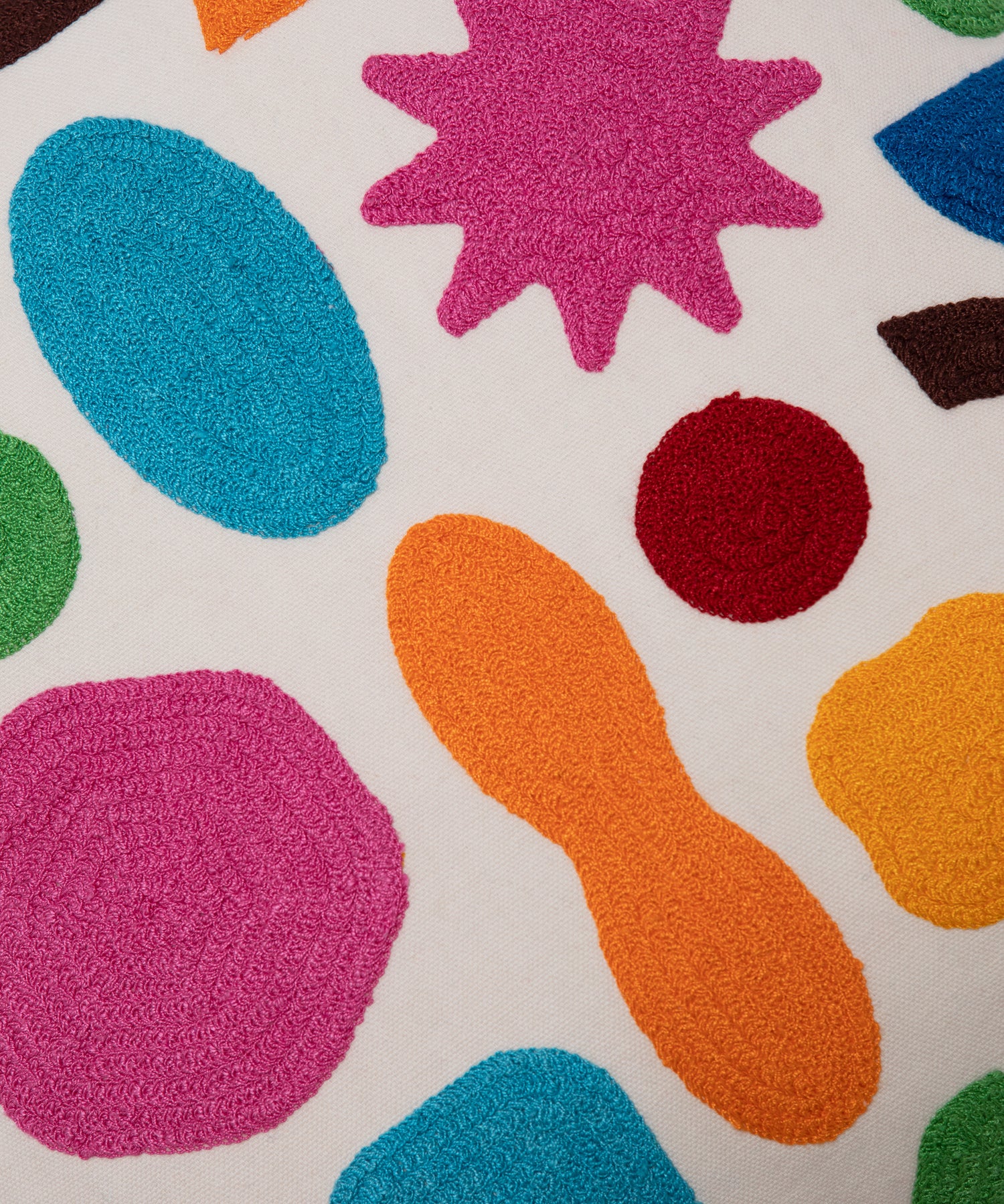 Close up of the different colored organic shapes on the Odds and Ends Pillow Cover.